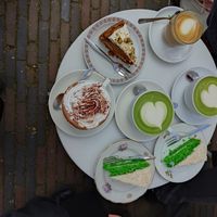Pandan cakes (bright green), matcha drinks (green), hot chocolate (the one with whipped cream), carrot cake with pistachio frosting, cappuccino at KLUTS in Utrecht