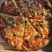 Tomatoes and Green Olives on a pizza   at Pizza Pizza in Mississauga