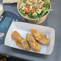 Fried seitan with avocado salad at Ropogó Premier in Biatorbagy