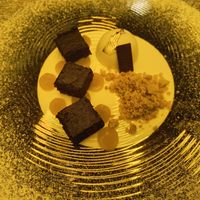 Vegan brownie with mango chutney and edible gold at Kinzu Sushi Experience in Rovereto