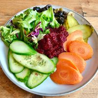 Beetroot hummus with salad  at Baker's Kitchen Destination Restaurant in Dubai