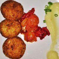Artichoke cakes with root vegetable purée  at Nanuchka in Tel Aviv