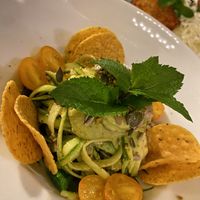 Tagliatelle di zucchine, gallette, pesto di pistacchio e datterini. at MINT Cucina Fresca in Polignano A Mare