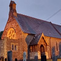 The church in front of the cottage at night at Gorllan in Eglwyswrw