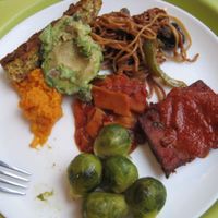 Buffet plate with Brussels sprouts, BBQ tofu, Thai seitan, garlic spaghetti, avocado, veggie pâté and mashed sweet potatoes. It was very good. at Resto Vego - McGill College in Montreal