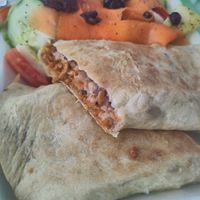 Tasty plant-based meat burrito and salad at Wake Up Vallarta in Puerto Vallarta