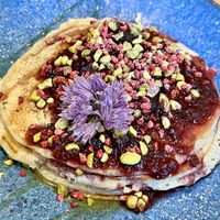 Cherry and pistachio pancakes   at Roots Cafe Inv in Inverness