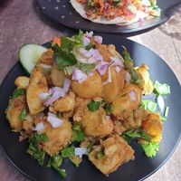 Alu Sandheko 12.95 - marinated potatoes w/herbs and spice at Magic Momo Kafe  in West Footscray