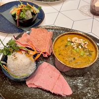 Panang Curry with rice, pink lavash bread & salad  at ALEX in Weil Am Rhein