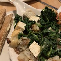 Tofu Scramble: Fresh spinach, tomatoes, and baked tofu on a bed of hashbrowns. Served with dry, whole-wheat toast  at Main Street Bistro in New Paltz