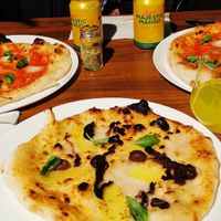 Pizzas and mango soft drinks at FLIP - Vegan Pizza in Tampere