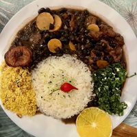 Feijoada… black beans, carrots and seitan with rice, collard greens, crispy something topping    at Vêjé Viver Bem  in Nice