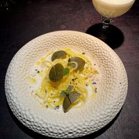 potato pasta in creamy almond-lemon sauce with caper leafs and fermented black pepper  at Pramerl & the Wolf in Vienna