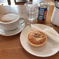Oat latte and almond Bakewell tart    at The Heron Farm Shop & Kitchen in Strathaven