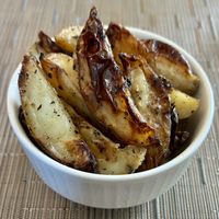 Roasted potato wedges   at Britpop Brunch - Great British Restaurant in Dubai