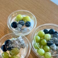 Greek yogurt topped with seasonal fresh fruit, added fresh after ordering. at Touch Cafe in Tomigusuku