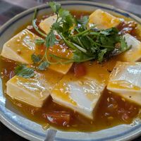 Silken tofu in tomato sauce at Vườn chay Quin's Garden in Dong Ha