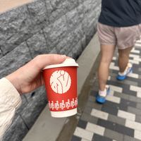 Matcha latte in compostable cup  at HiKESHi SPiRiT OTO-GUMI - 火消魂音組 in Tokyo