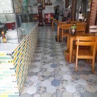 She sublets from the main restaurant. Access to their facilities including this dining area at Hu Tiệu Chay in Ho Chi Minh City