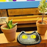 An adorable kitty coaster inside .  at Pawsitive Vibes in Kuching