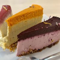 Vegan cheesecake: Blueberry & lavender, mango & sea buckthorn, and raspberry & pineapple   at Delicious Raw by Gabriela Oltean in Brasov