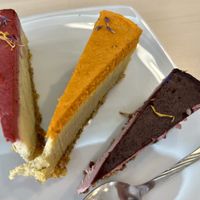 Vegan cheesecake: Blueberry & lavender, mango & sea buckthorn, and raspberry & pineapple   at Delicious Raw by Gabriela Oltean in Brasov
