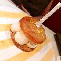 LA CALISSONNE

INSPIRED BY THE ICONIC CALISSON OF AIX-EN-PROVENCE: SOFT ALMOND BISCUIT, FLORAL DIPLOMAT CREAM, CITRUS CONFIT, CANDIED ORANGE. at Daimant Saint-Honoré in Paris