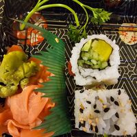 Vegetable roll (avocado, cucumber & pickled turnip, garnished with black & white sesame seeds)

Includes Wasabi & pickled pink ginger & soy sauce packet(soy sauce not pictured). at Kyo Ramen & Poke Bowl in Lombard