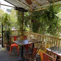 Part of the outdoor dining area. The plants are a nice hedge blocking the view of the parking lot right next to it    at Yuko Kitchen in Los Angeles