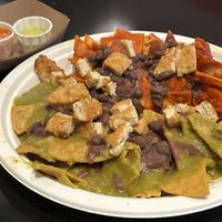 Chilaquiles (requested black beans instead of refried beans, Garden chicken, red and green sauce, no onions, no queso fresco, crema on the side )  at Tacotarian - Miracle Mile in Las Vegas