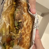 Crunchwrap in process with asada  at Tacotarian - Miracle Mile in Las Vegas