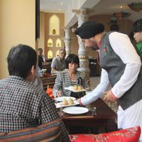 staff serving at redfort at Redfort Indian Restaurant in Xian