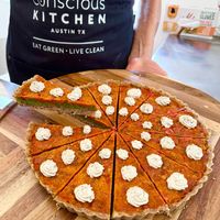 5 Layers of Love Pizza! We make the curst from nuts and herbs from our garden. Then layer, tapenade, pesto, marinara, and goatless goats cheese. Beyond flavorful! at Conscious Kitchen Atx in West Lake Hills