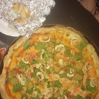 Vegandary pizza with extra falafel, and garlic knots. at Maguire's Pizza Bar in Liverpool