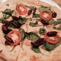 vegan pizza w spinach, black olives & tomatoes at Mellow Mushroom in Chattanooga