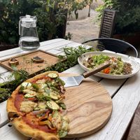 The pizza is around 16”. Enough for two    at Hungry Buddha - Maybe closed in Shaxi