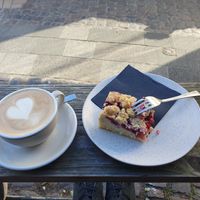 Cappuccino with oat milk & vegan cherry cake with crumbles at Marmalade Café & Bar   in Hamburg