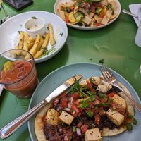 Vegan Chilaquiles, Vegan Huevos Rancheros, and fries with vegan truffle aioli at Robin's Restaurant in Cambria