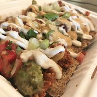 Nachos in compostable to go container at Healthy Sins Vegan Cafe in Lockport