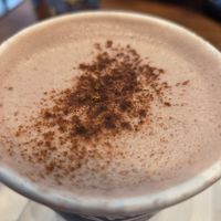 Oatmilk vegan hot chocolate with cinnamon on top at Vanilla Gorilla Cafe in New York City