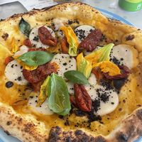 Vegetarian pizza with vegan cheese   at Sud in Riva Del Garda