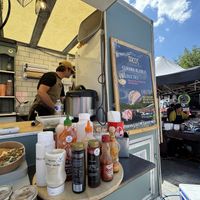 Stall with help yourself condiments. Not needed as already tasty   at Soulful Bowl in Wiltshire
