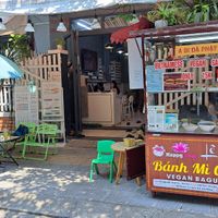 2026-03 a booth with two tables outside at Bánh Mì Chay Lê Hội in Da Nang