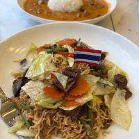 Drunken noodles with steak in the front, panag current with steak in the back at Kanlaya in Chicago