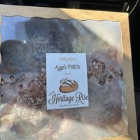 Huge apple fritters. 4 in the box  at Heritage Rise Sourdough in Elk Grove