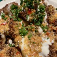Spicy cauliflower with tahini sauce  at Sittoo's in University Heights