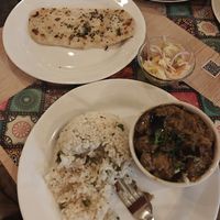 Naan and "Aloo Baingan" that was more like mushy eggplant dish, don't recommend. at Santa Masala in Santa Marta