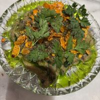 Aubergine grillée, tahini, amandes grillées à l’harissa  at Noah in Krakow