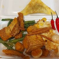 Various mock meats over rice at Thiện Ân in Ho Chi Minh City