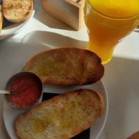 Fresh orange juice and bread with oil and tomato at Isolina  in Malaga